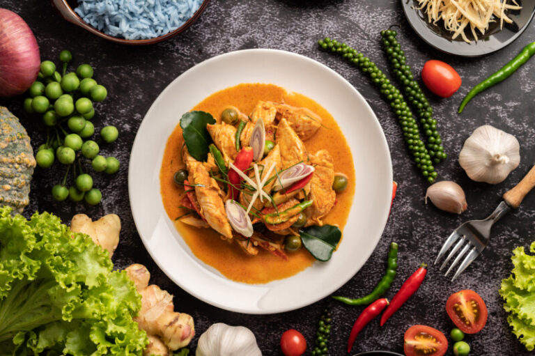 dry green curry with chicken in white plates on bl 2025 01 16 14 06 06 utc